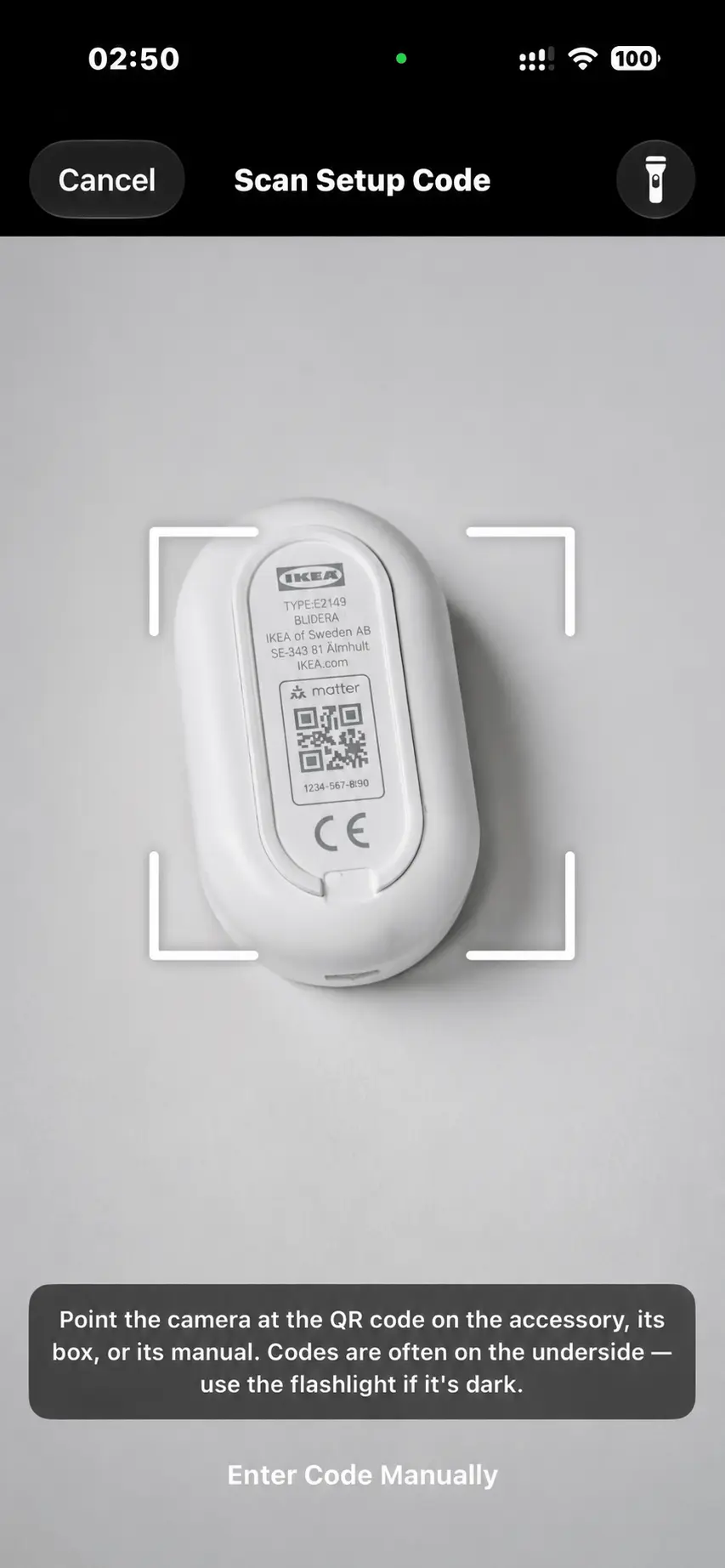 PLACEHOLDER — the scanner, reading the QR code printed on an accessory.